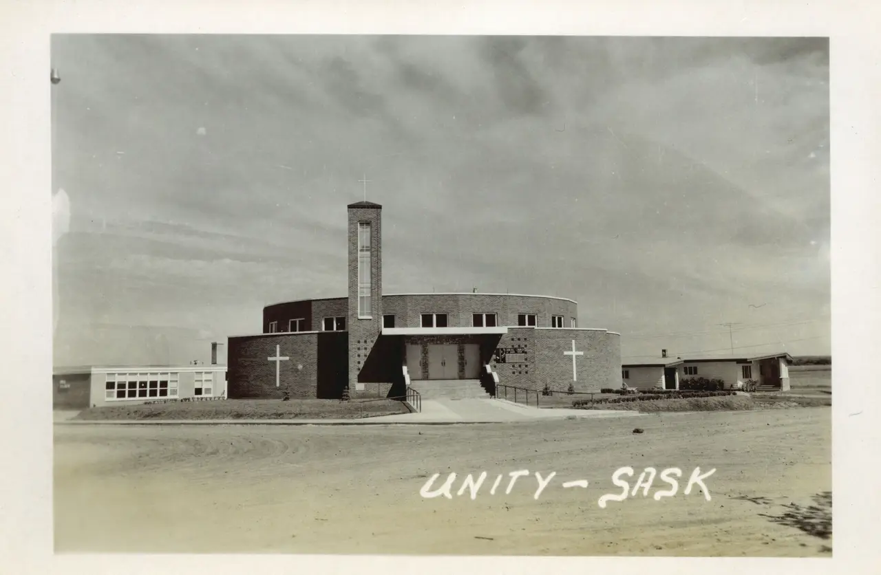 Brick church with bell tower, Unity, about 1950s